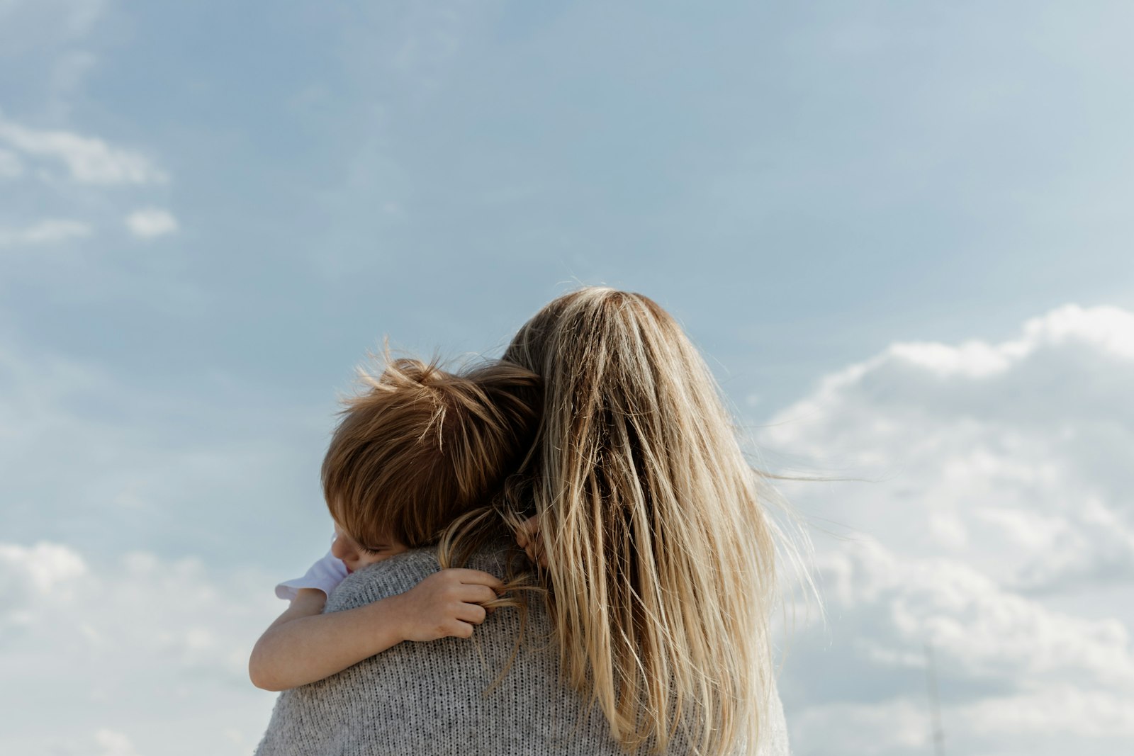 mother hugging child