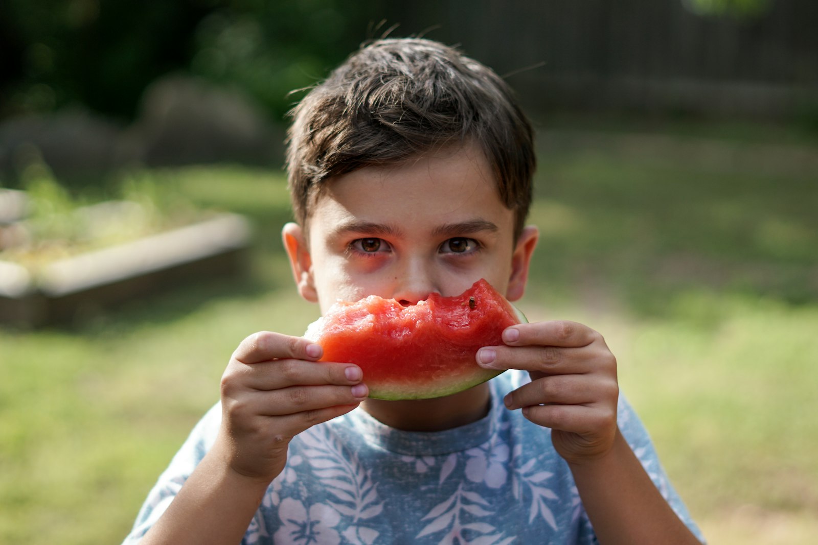 child tasting vegetables